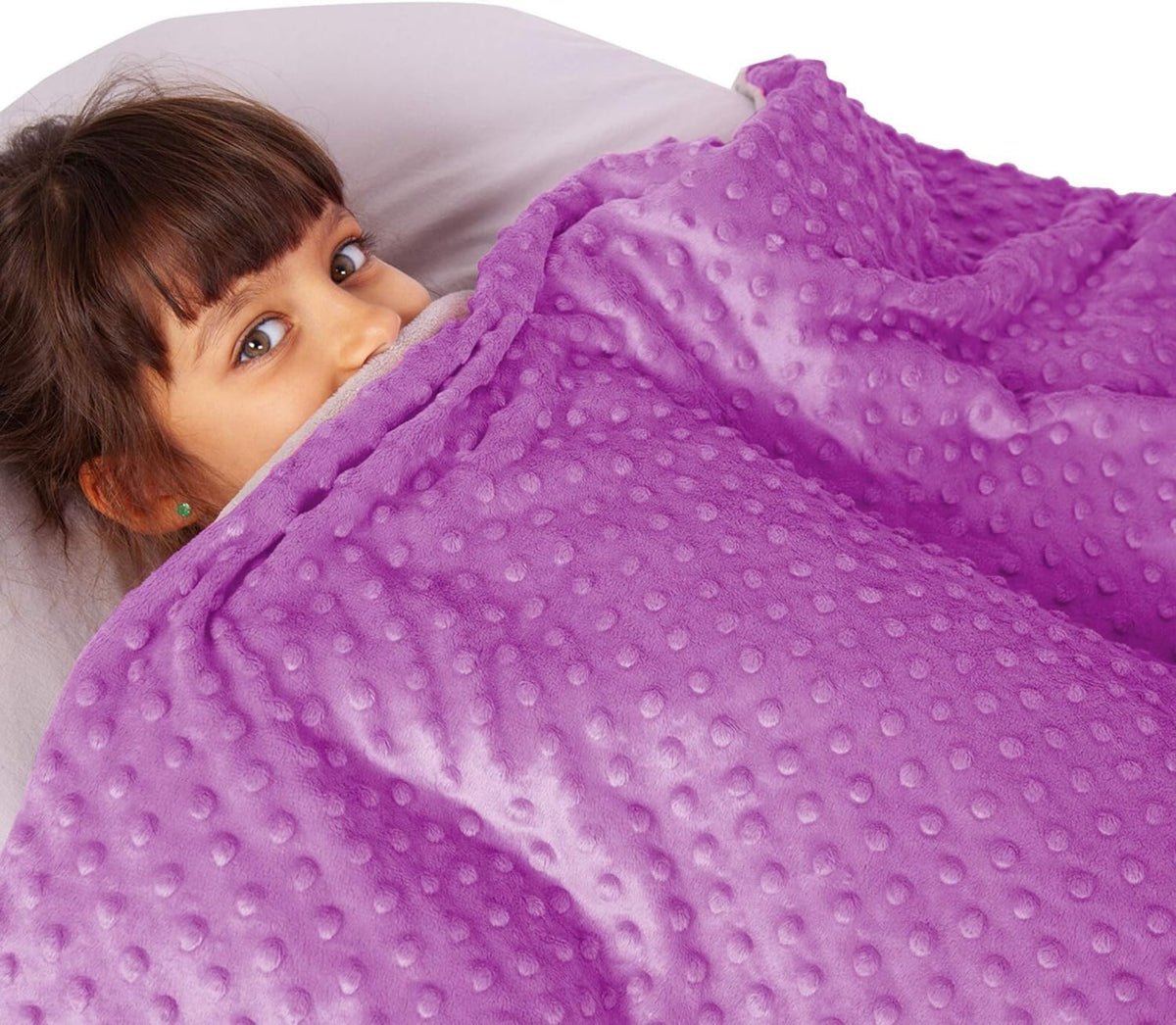 Girl under the Hazli 7 lb kids weighted blanket with violet minky cover